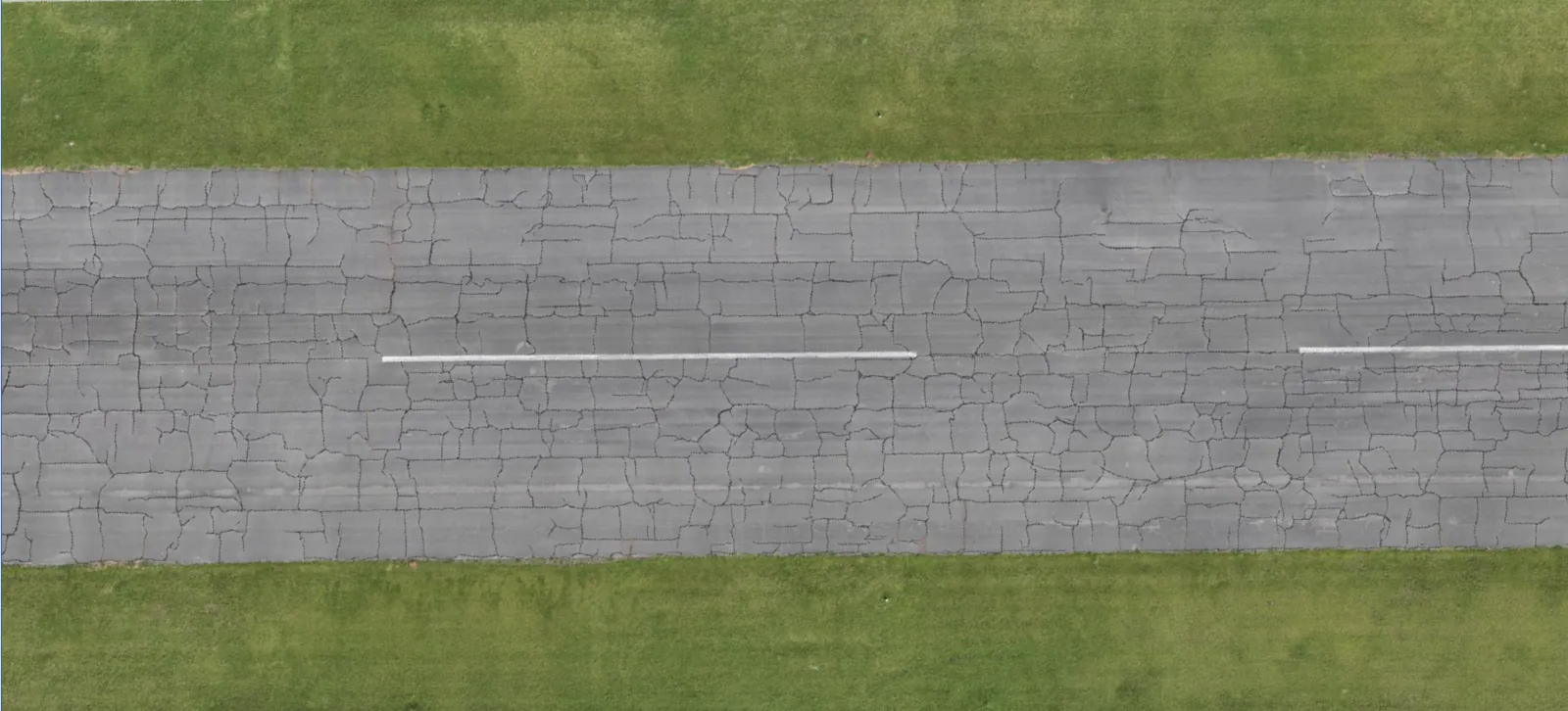 An airport runway before analysis, with its crack network visible