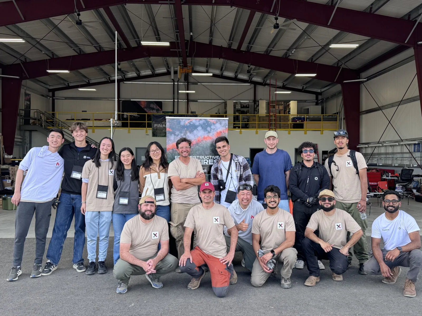 The Wildfire Quest team gathered in a hangar during XPRIZE Wildfire finals testing